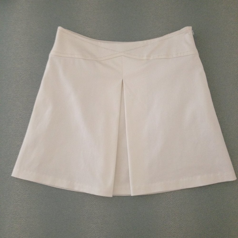 Bebe satin pleated mini skirts in cream white.